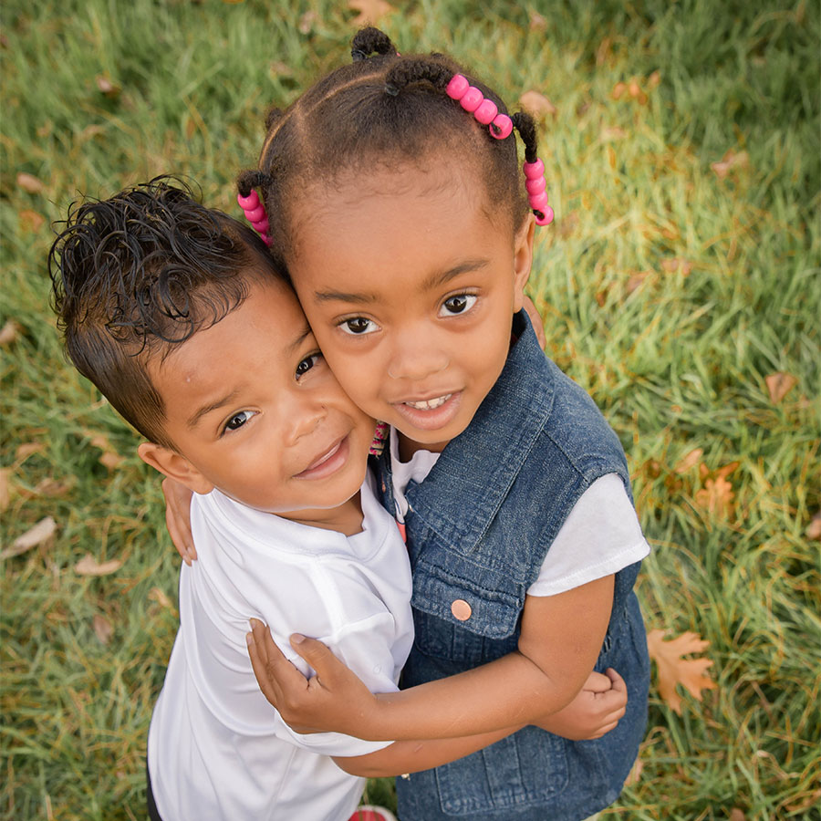 Two kids hugging